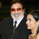 Vinod Khanna poses with his wife on the red carpet at the IIFA awards in Dubai