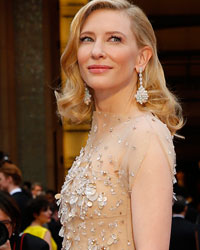 Cate Blanchett, best actress winner for her role in 'Blue Jasmine' wears a nude Armani gown with metallic embellishments as she poses on the red carpet at the 86th Academy Awards in Hollywood