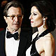 Actor Gary Oldman and his wife Alexandra Edenborough arrive for the BAFTA awards ceremony at the Royal Opera House in London