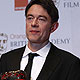Peter Straughan celebrates after winning the award for adapted screenplay for Tinker Taylor Soldier Spy at the BAFTA awards ceremony in Londo