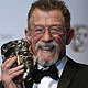 Actor John Hurt holds the Outstanding British Contribution to Cinema award at the BAFTA awards ceremony in London