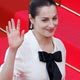 Actress Amira Casar waves as she arrives for the screening of Brazilian director Fernando Meirelles`s film Blindness on the opening night of the 61st Cannes Film Festival