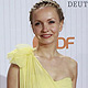 German actress Janin Reinhard poses on the red carpet as she arrives for the German Film Prize (Lola) ceremony in Berlin