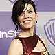Margulies poses with her award for Best Performance by an Actress in a Television Series-Drama as she arrives at the Warner Bros./InStyle after party