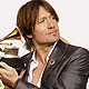 Keith Urban holds his award backstage for best male country vocal performance for `Sweet Thing` at the 52nd annual Grammy Awards in Los Angeles