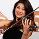 My Grammy Moment winner Ann Marie Calhoun poses with her violin backstage at the 50th Annual Grammy Awards in Los Angeles