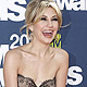 Actress Chelsea Kane holds down her skirt as the wind blows at the 2011 MTV Movie Awards in Los Angeles