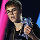 Singer Justin Bieber accepts the award for best male video for 'U Smile' at the 2011 MTV Video Music Awards in Los Angeles