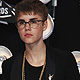 Singer Justin Bieber arrives holding a snake in his hand at the 2011 MTV Video Music Awards in Los Angeles