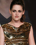 Kristen Stewart poses for pictures before German premier of The Twilight Saga: Breaking Dawn Part 2 in Berlin