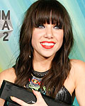 Carly Rae Jepsen holds her three awards backstage at the MuchMusic Video Awards in Toronto