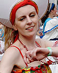 Performers dance in the street during the children's day parade at Notting Hill Carnival in west London