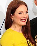 Julianne Moore holds her Emmy award Tom Hanks at the 64th Primetime Emmy Awards