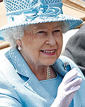 Britain's Queen Elizabeth waves as she arrives with the Duke of Edinburgh to attend the first day's racing at Royal Ascot, southwest of London