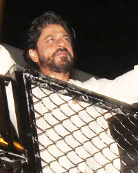 Shah Rukh Khan waves to his fans on the eve of his 50th birthday at his residence Maanat in Mumbai