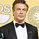 Alec Baldwin poses backstage with his award for '30 Rock', at the 18th annual Screen Actors Guild Awards in Los Angeles