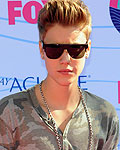 Singer Justin Bieber arrives for the Teen Choice 2012 awards in Los Angeles