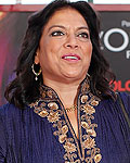 Indian film director Mira Nair poses on the red carpet of her movie 'The Reluctant Fundamentalist' at the 69th Venice Film Festival