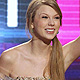 Singer Taylor Swift accepts the award for Favorite Female Country Artist at the 2011 American Music Awards