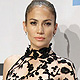 Jennifer Lopez poses backstage after winning the Favorite Latin Music Artist award at the 2011 American Music Awards