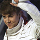 Singer Justin Bieber smiles as he performs at the 2011 American Music Awards in Los Angeles