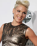 Singer Pink poses as she arrives at the 40th American Music Awards in Los Angeles