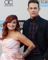 Singer James Durbin and Heidi Durbin arrive at the 41st American Music Awards in Los Angeles, California