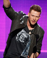 Hip hop artist Nelly with Brian Kelley and Tyler Hubbard (R) of Florida Georgia Line accept the single of the year award at the 41st American Music Awards in Los Angeles, California