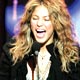 Colombian singer Shakira reacts as she accepts the favorite Latin Music artist award during the 2005 American Music Awards in Los Angeles