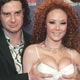 Adult film stars Bauer and Hollander pose as they arrive for AVN Awards Show in Las Vegas