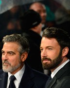 George Clooney and Ben Affleck pose as they arrive for the British Academy of Film and Arts (BAFTA) awards ceremony at the Royal Opera House in London