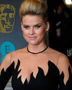 Actress Alice Eve poses as she arrives for the British Academy of Film and Arts (BAFTA) awards ceremony at the Royal Opera House in London