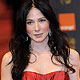 Actress Lynn Collins arrives at the BAFTA awards ceremony in London