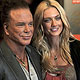 Actor Mickey Rourke and model Elena Kuletskaya arrive at the BAFTA awards ceremony in London