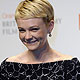 Actress Carey Mulligan poses with her award for Best Actress for `An Education` during the BAFTA awards ceremony