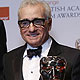 Director Martin Scorsese celebrates his fellowship award with presenter Max von Sydow at the BAFTA awards ceremony in London