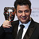 Ludovic Bource celebrates winning the Original Music award for 'The Artist' at BAFTA awards