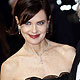 Director Simon Curtis and his wife Elizabeth McGovern smile as they arrive for the BAFTA award ceremony in London