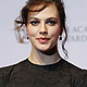 Jessica Brown Findlay poses after presenting the award for editing for Senna, at the BAFTA awards ceremony