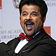 Award presenter Anil Kapoor poses for photographers at BAFTA awards ceremony at the Royal Opera House in London