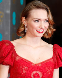 Eleanor Tomlinson arrives at the British Academy of Film and Arts (BAFTA) awards ceremony at the Royal Opera House in London