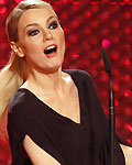 German comedian Bambi Martina Hill holds up her trophy for Comedy during Bambi Awards 2012 in Duesseldorf