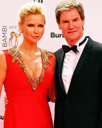 Actress Veronica Ferres and her partner Carsten Maschmeyer arrive on the red carpet for the Bambi 2013 media awards ceremony in Berlin