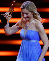 Actress Nadja Uhl receives the trophy for National Actress during the Bambi 2013 media awards ceremony in Berlin