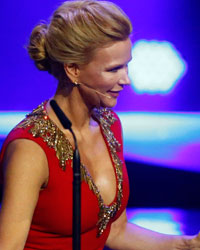 Actress Veronica Ferres presents violinist David Garett (R) with throphy for Classic during Bambi 2013 media awards ceremony in Berlin