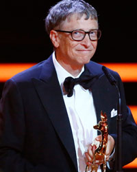 Microsoft founder Bill Gates makes a speech after receiving the Millennium Bambi during the Bambi 2013 media awards ceremony in Berlin