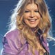 Singer Fergie smiles on stage after she performed Party People with Nelly at the 2008 BET Awards in Los Angeles