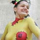 A stylist prepares his model during a body art contest in the Black Sea port of Odessa.