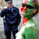 A policeman watches a model as she poses for a photograph before the start of a body art contest in the Black Sea port of Odessa.