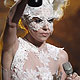 U.S. singer Lady Gaga holds up her one of her awards at 30th Brit Awards ceremony at Earl`s Court in London